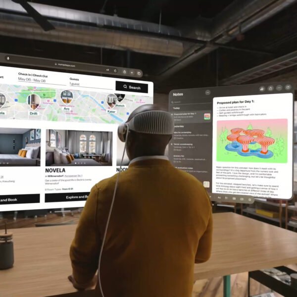a person wearing an apple vision pro vr headset, looking at the hooked screens in virtual world